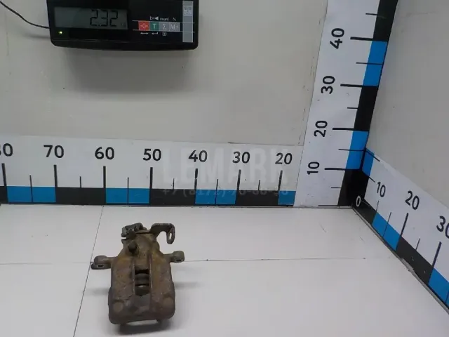 Суппорт тормозной задний левый