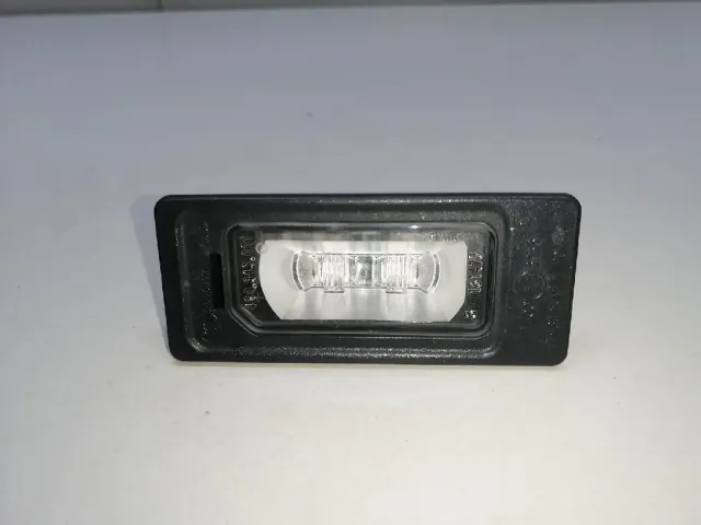 Фонарь подсветки номера для  Ford Cougar 1998-2001