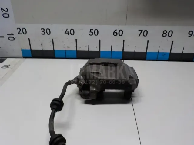 Суппорт тормозной передний левый