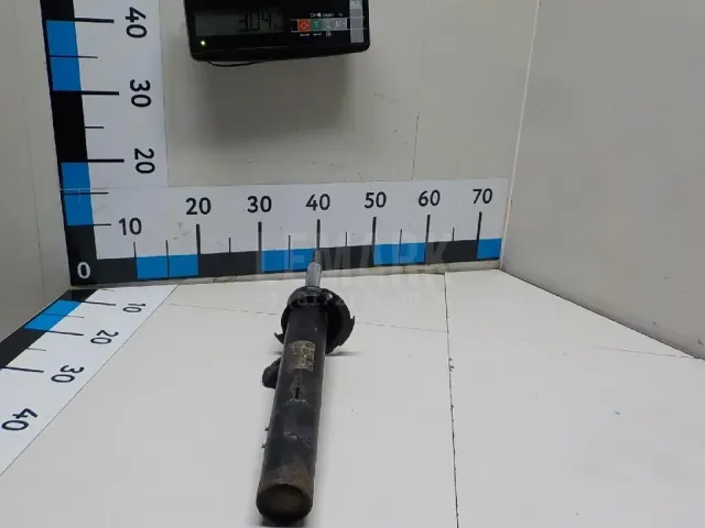 Амортизатор передний левый