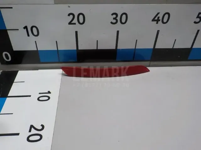 Отражатель в бампер задний левый