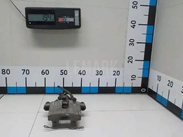 Суппорт тормозной задний левый
