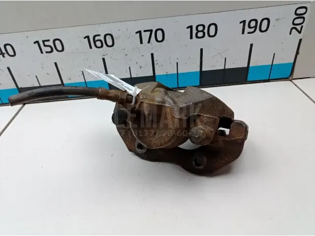 Суппорт тормозной передний левый