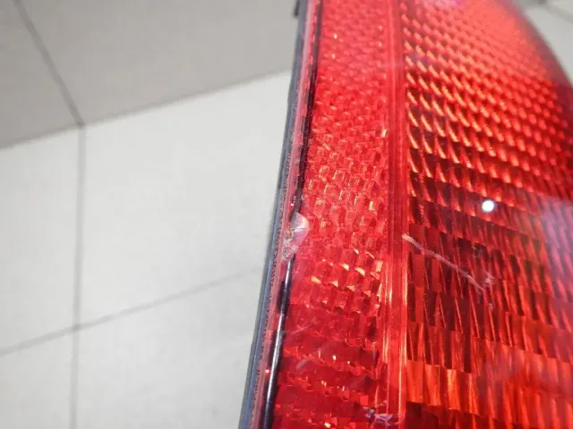 Фонарь задний в бампер левый для  Daihatsu